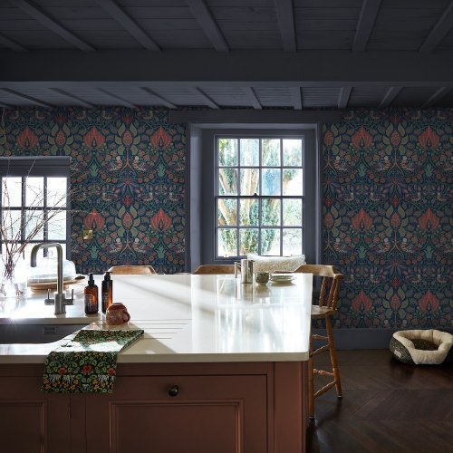 Room styled with William Morris at Home Dove & Rose Midsummer wallpaper in a bold, nature-inspired setting