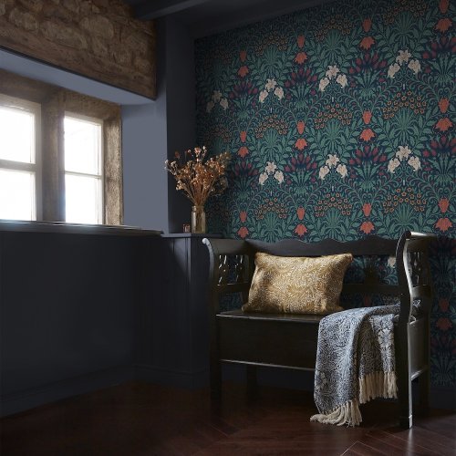 Room shot with Garden Moonlight wallpaper and rich-toned furniture