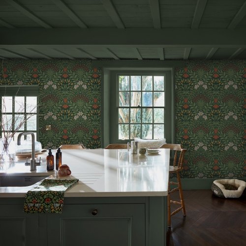 Room shot featuring Garden Moss Green wallpaper in a styled interior