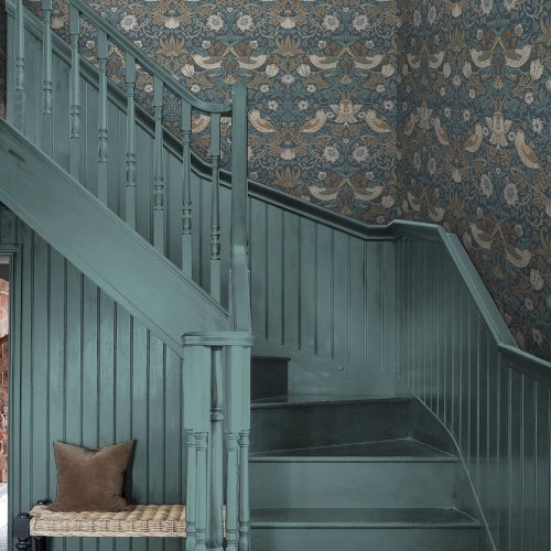 Room shot with Strawberry Thief Washed Blue wallpaper in a styled interior