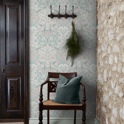 Room shot with Blackthorn Meadow wallpaper in a styled interior