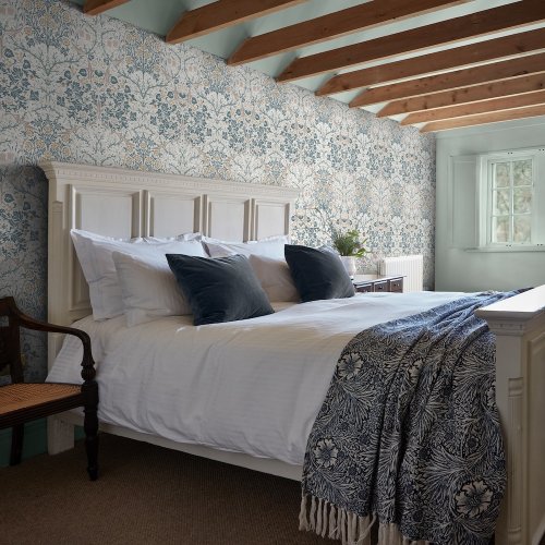 Room shot featuring Blackthorn Daydream wallpaper in a modern interior