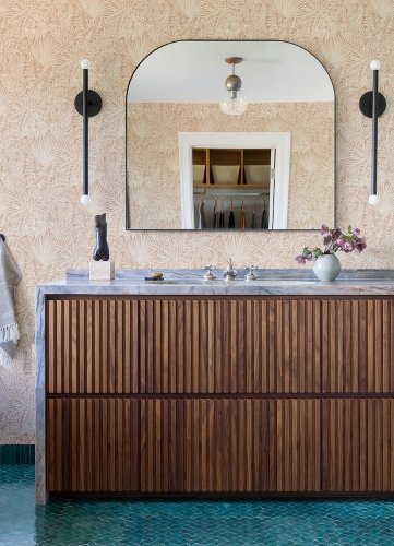 A Street Prints Vita Pink Wallpaper styled in a living room