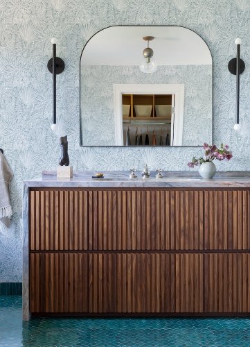 A Street Prints Vita Blue Wallpaper in a light-filled lounge with natural textures