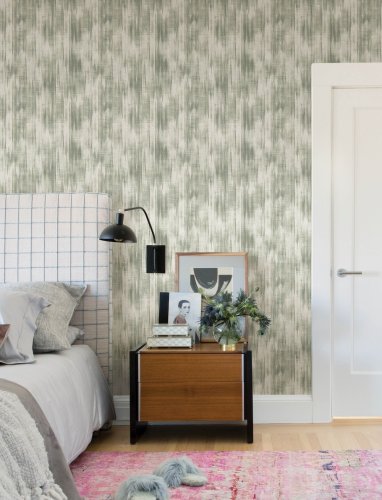 A Street Prints Marvel Sage Wallpaper styled in a modern living space, enhancing the walls with its soft sage green tones