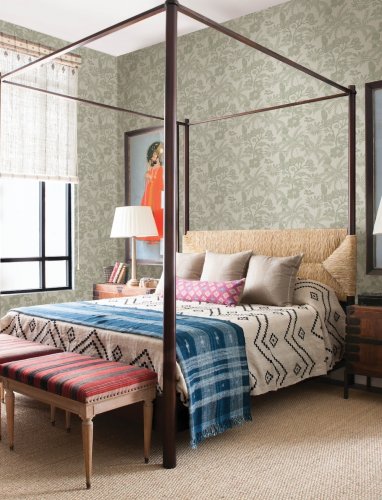 A Street Prints Jacaranda Sage Wallpaper with an intricate tropical-inspired print of foliage and flowers, creating an elegant and calming aesthetic.