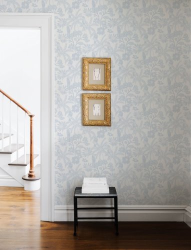 A Street Prints Jacaranda Blue Wallpaper with a textured background and botanical design, ideal for feature walls.
