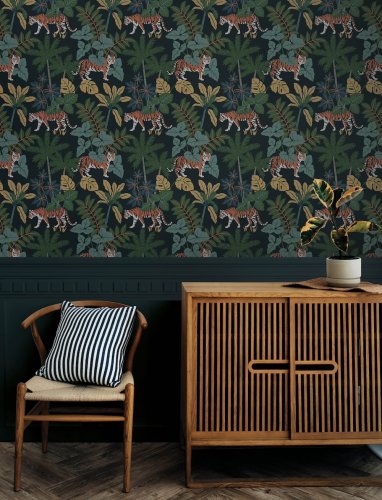 A Street Prints Caspian Blue Wallpaper showcasing exotic flora and wildlife, creating a striking and dramatic look.