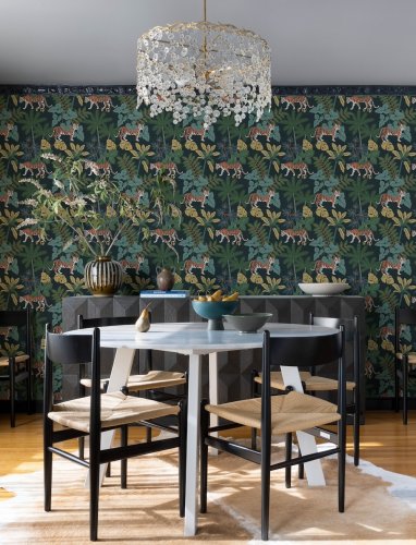 A Street Prints Caspian Blue Wallpaper with a jungle-inspired pattern, ideal for feature walls and adventurous interiors.