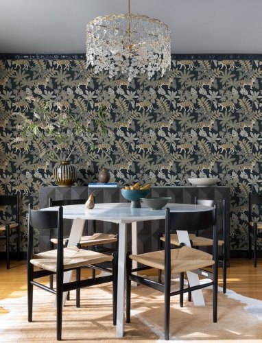 A Street Prints Caspian Charcoal Wallpaper with exotic tigers and rich botanical elements creating a bold and dramatic statement.