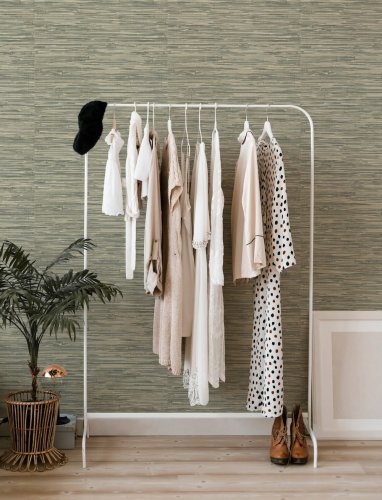 A Street Prints Exhale Green Wallpaper with a neutral green colourway, perfect for adding texture and warmth.