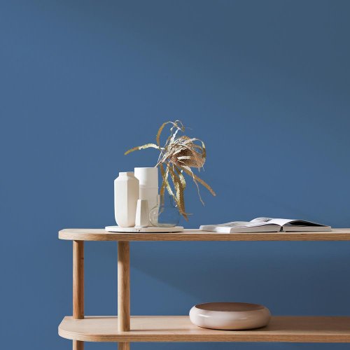 Interior room painted in Craig & Rose Flanders Blue with relaxed, classic styling