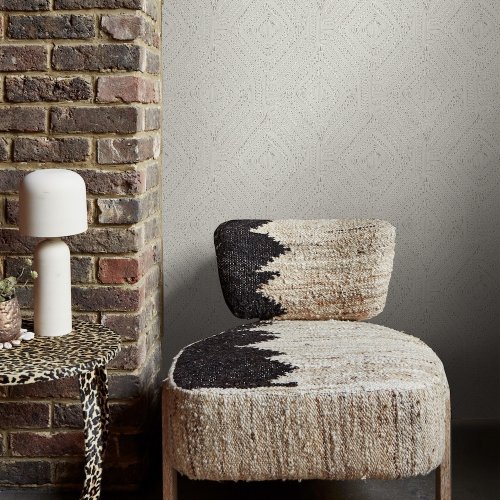 Room styled with Abigail Ahern Artisan Weave Cream wallpaper in a warm, serene setting