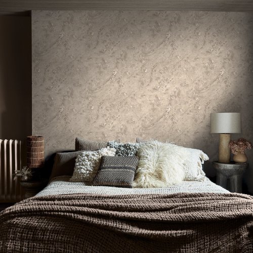 Second room view of Abigail Ahern Boheme Marble Almond wallpaper with warm, layered décor