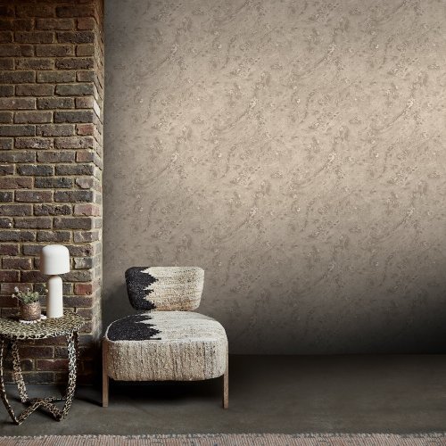 Room styled with Abigail Ahern Boheme Marble Almond wallpaper in a calm, earthy interior
