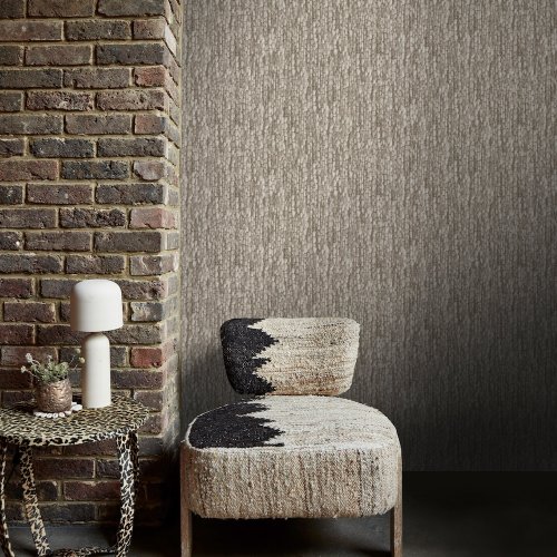 Second room view of Abigail Ahern Heirloom Knit Greige wallpaper with layered, rustic decor