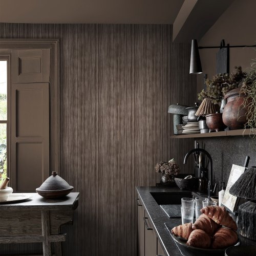 Second room view of Abigail Ahern Linear Luxe Deep Greige wallpaper with layered, elegant decor