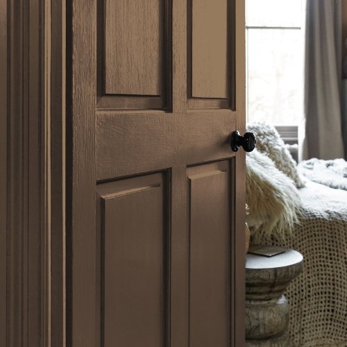 Painted door in Abigail Ahern Owasco Olive with warm, layered styling