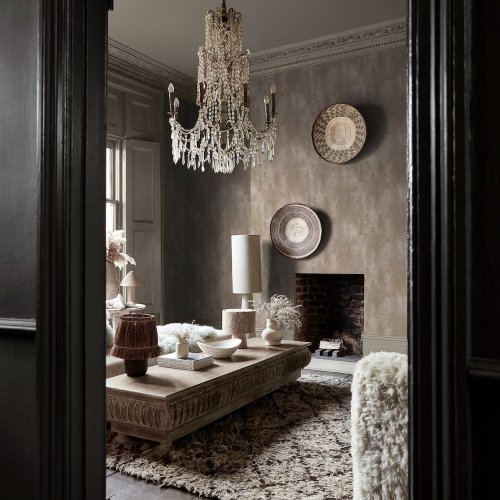 Second room view of Abigail Ahern Oxidized Opulence Limestone wallpaper with earthy, industrial decor