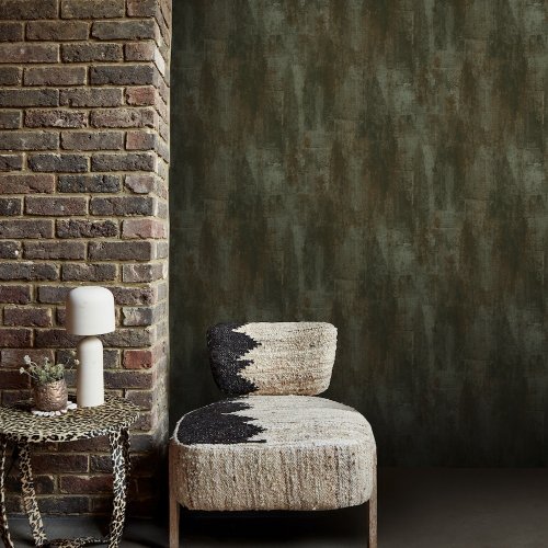 Room styled with Abigail Ahern Oxidized Opulence Moss wallpaper in a moody, organic setting