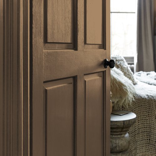 Painted door in Abigail Ahern Summer Earth with soft, golden-toned styling