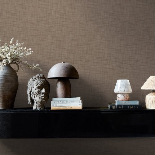 Room styled with Abigail Ahern Weathered Linen Cocoa wallpaper in a soft, layered interior