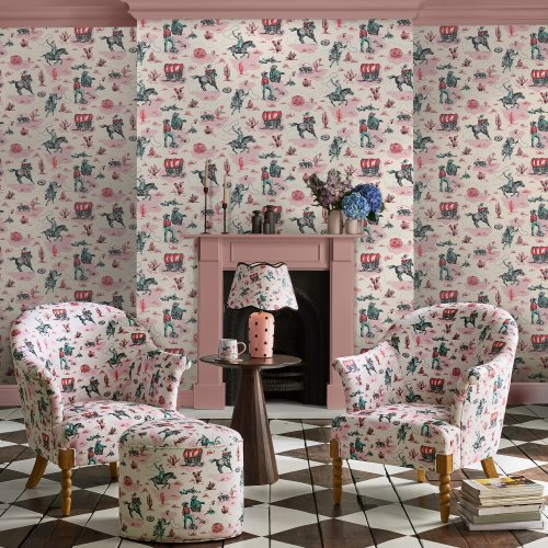 Room decorated with Cowgirls Pink wallpaper, featuring cowgirls, cacti, and wagons in a vibrant pink colour palette