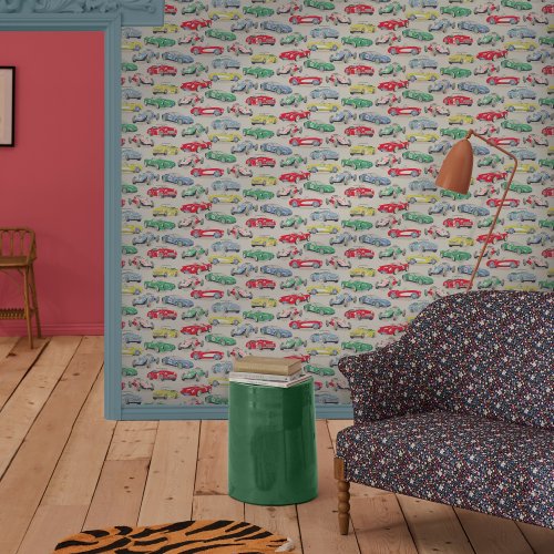 Room decorated with Vintage Cars Multi wallpaper, showcasing bright pastel cars against a grey backdro