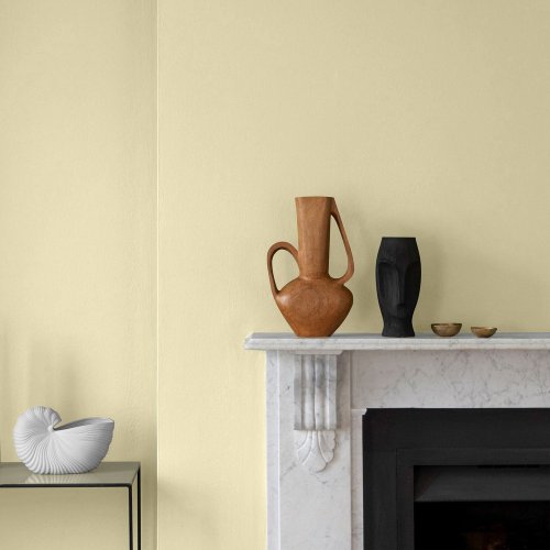 Interior room painted in Craig & Rose Jasper Yellow with soft, historic styling