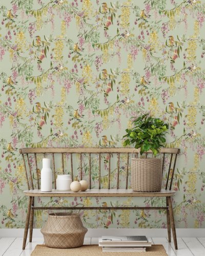 Paul Moneypenny Floral Hall wallpaper styled in a modern room with vibrant tropical print and soft green tones.