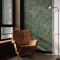 Living room styled with Superfresco Richmond Forest Green Wallpaper featuring delicate foliage print and natural textures.