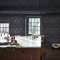 Room styled with William Morris at Home Dove & Rose Midsummer wallpaper in a bold, nature-inspired setting