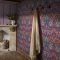 Second room view of William Morris at Home Dove & Rose Carnival wallpaper with bold bird and vine detail