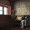 Room styled with Dove & Rose Olive wallpaper in a vibrant, natural interior