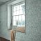 Room shot showing Honeysuckle Breeze wallpaper with blue floral pattern