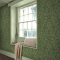 Room shot featuring Acorn Garden Green wallpaper with forest green tones