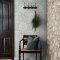 Room shot with Blackthorn Meadow wallpaper in a styled interior