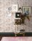 A Street Prints Marvel Pink Wallpaper styled in a contemporary interior, creating a soft and inviting atmosphere