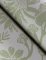 A Street Prints Jacaranda Sage Wallpaper showing delicate palm leaves, floral detailing, and a subtle vertical texture in soft green.