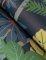 A Street Prints Caspian Blue Wallpaper showing bold foliage and tiger details in rich green and golden tones.