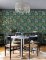 A Street Prints Caspian Green Wallpaper with a bold botanical design, perfect for creating a striking feature wall.