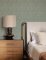 A Street Prints Gallivant Green Wallpaper with an elegant texture, ideal for creating a cosy feature wall.