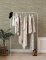 A Street Prints Exhale Natural & Green Wallpaper featuring a neutral colour palette for a warm and stylish look.