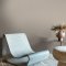 Room styled with Abigail Ahern Artisan Weave Fawn wallpaper in a soft, earthy interior