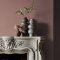 Fireplace wall painted in Abigail Ahern Baked Madagascar with soft, layered textures