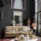 Interior room painted in Abigail Ahern Beekman Black with layered, moody styling