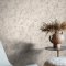 Room styled with Abigail Ahern Boheme Marble Dove wallpaper in a calm, neutral setting