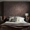 Second room view of Abigail Ahern Boheme Marble Mocha wallpaper with layered natural deco