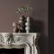 Fireplace wall painted in Abigail Ahern Canyon Valley with textured, natural decor