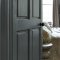 Painted door in Abigail Ahern Dakota Mountain with deep, woodland-inspired styling